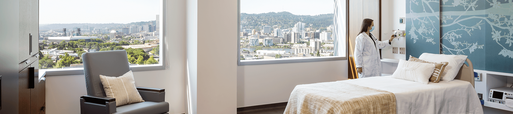 Doctor adjusts equipment in patient room